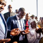 ALA_Praying near solar powered fountains SBathily and Akon